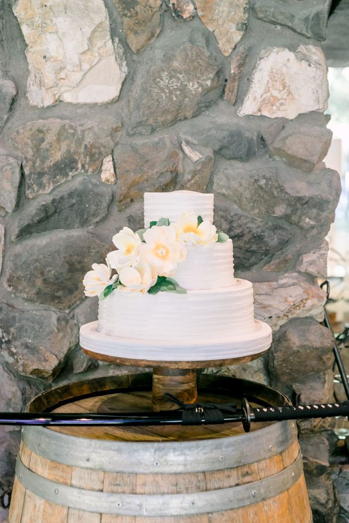 three tier wedding cake with sugar magnolia flowers