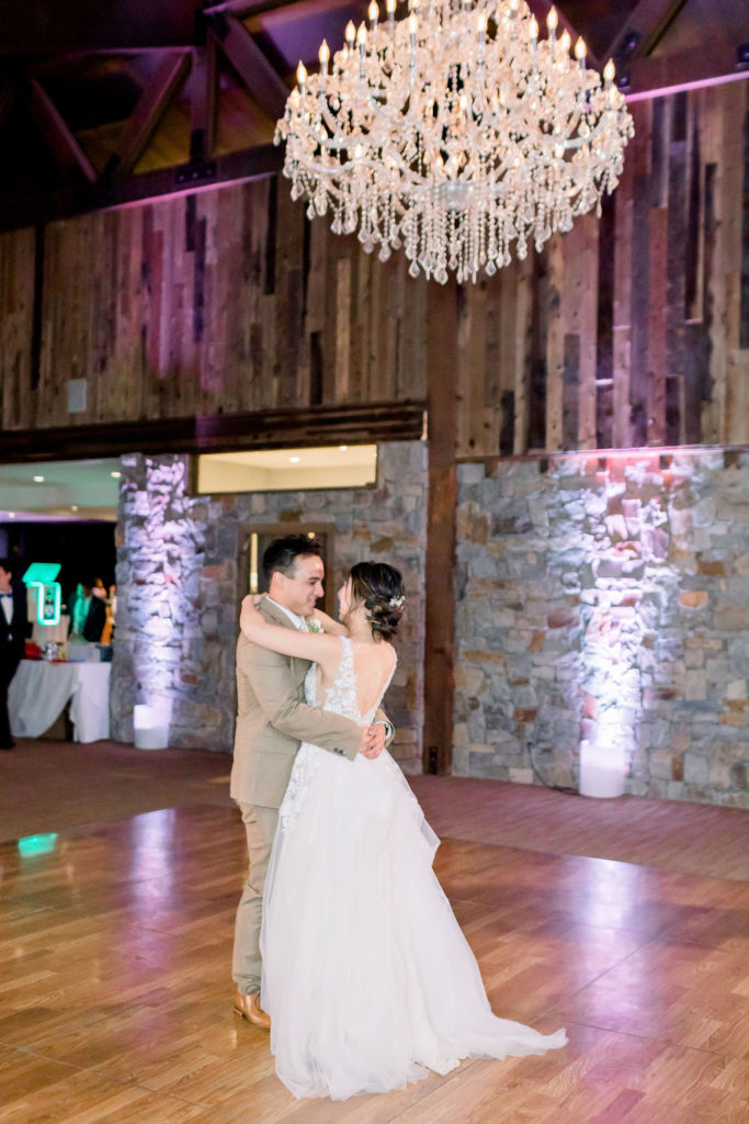 bride and groom share first dance in the Redwood Room at Calamigos Ranch
