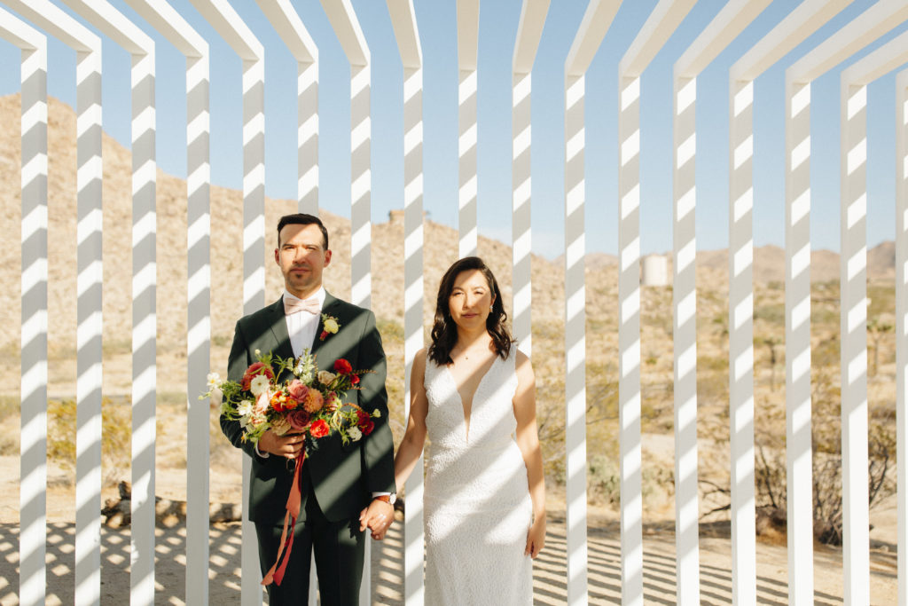 bride and groom portrait shot before desert elopement