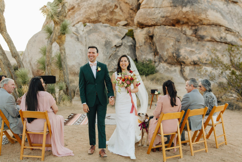 bride and groom recessional during wedding ceremony in Joshua Tree