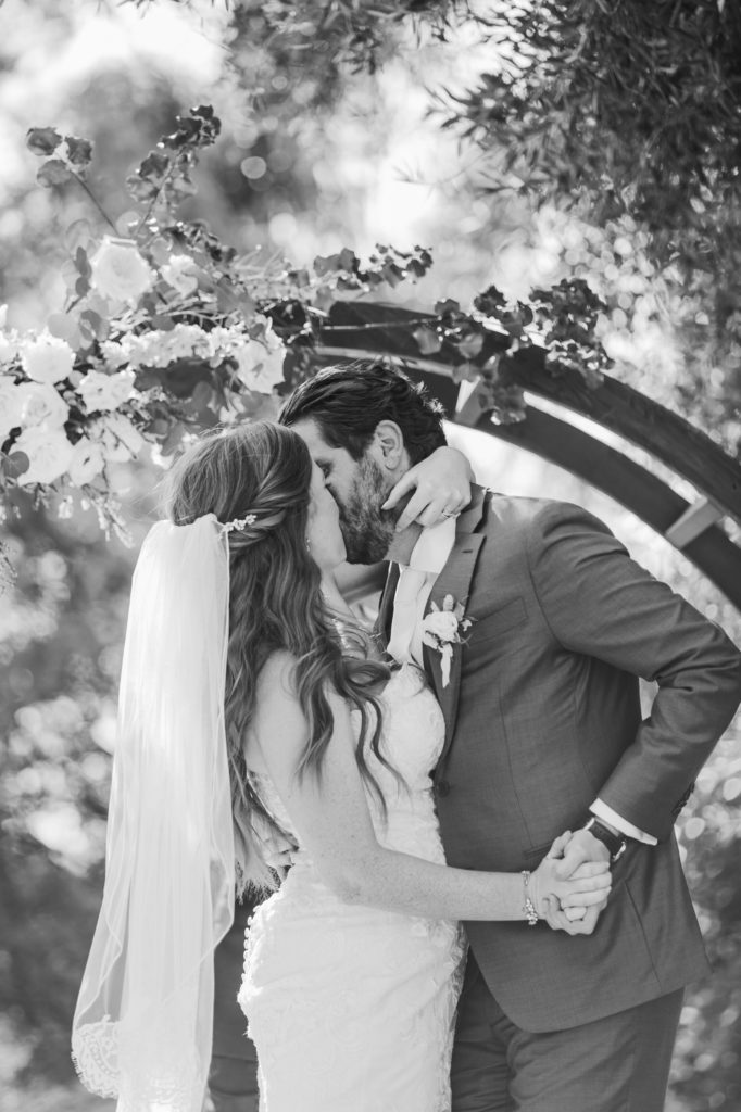 bride and groom first kiss during wedding ceremony in the Santa Monica Mountains