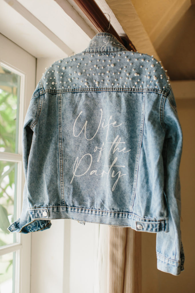 jean jacket with pearls and "wife of the party" calligraphy 