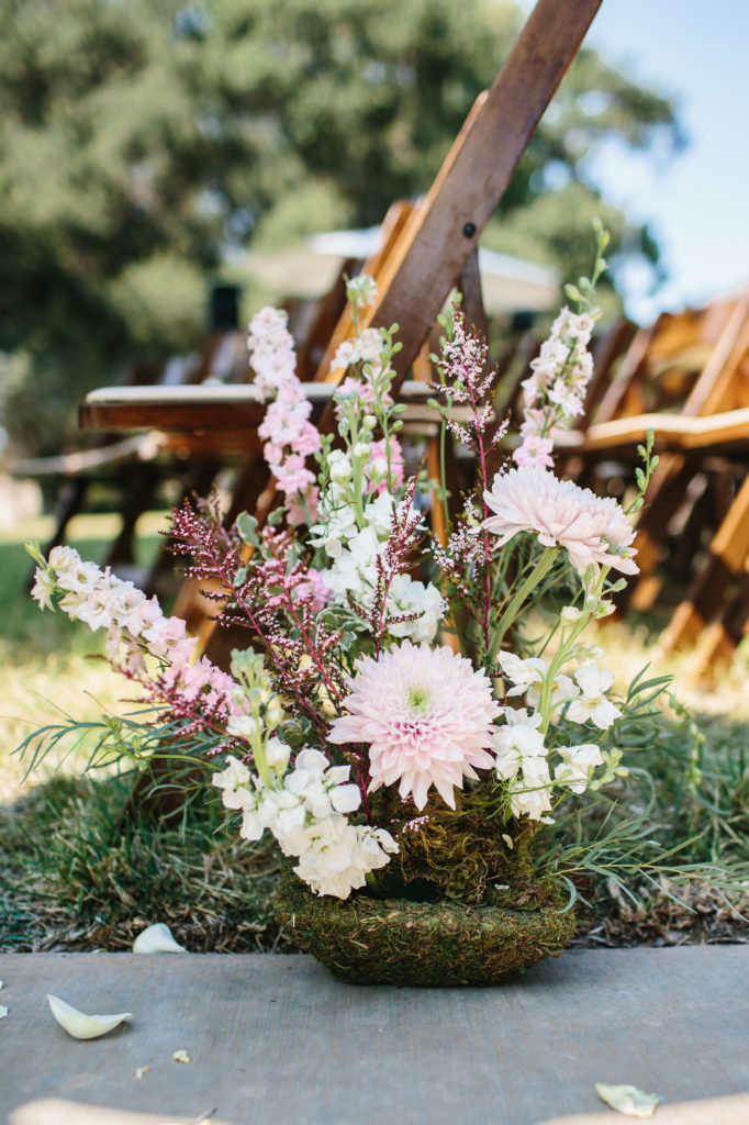 Wedding ceremony with wooden chairs and circle arch for an autumn wedding in the Santa Monica Mountains
