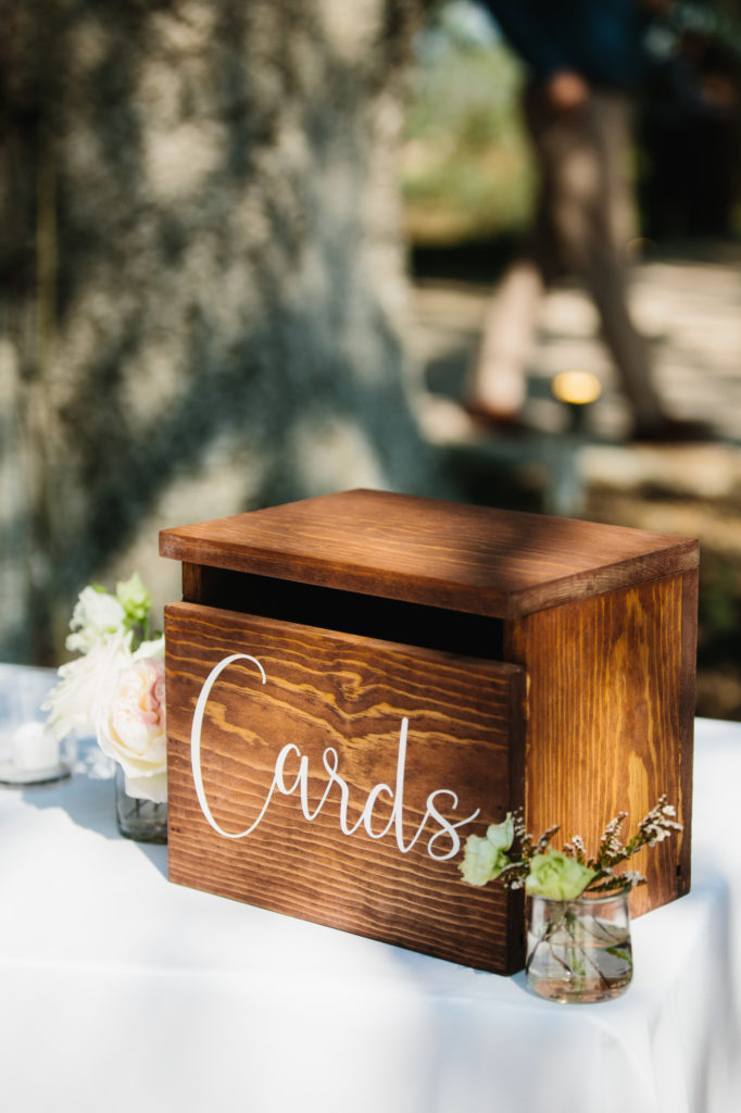 wooden card box at wedding welcome table