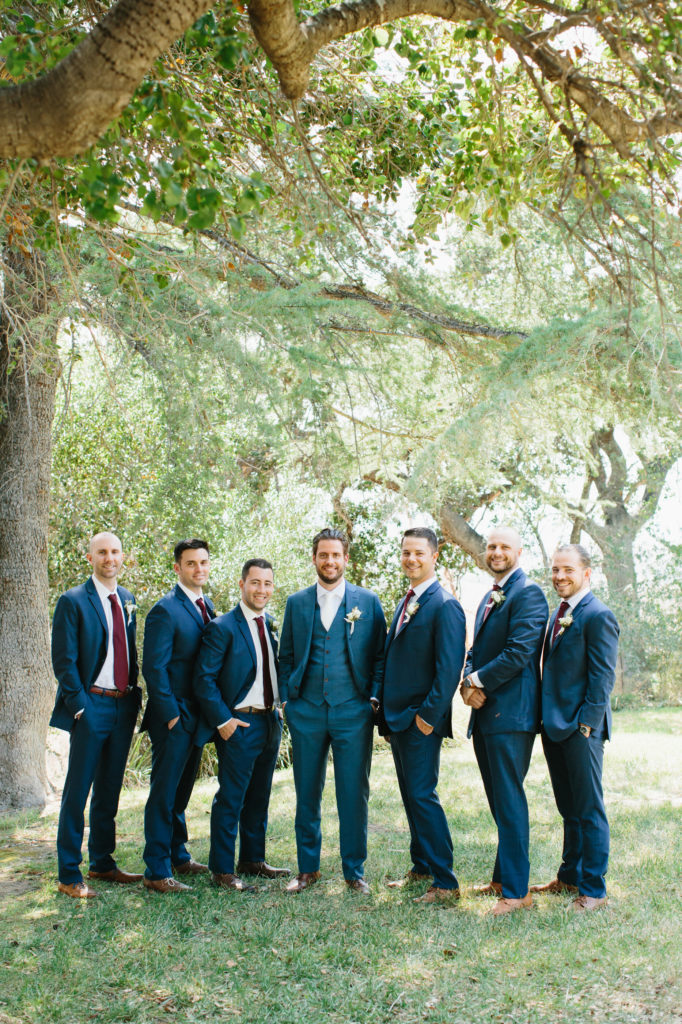 groom and groomsmen in blue suits