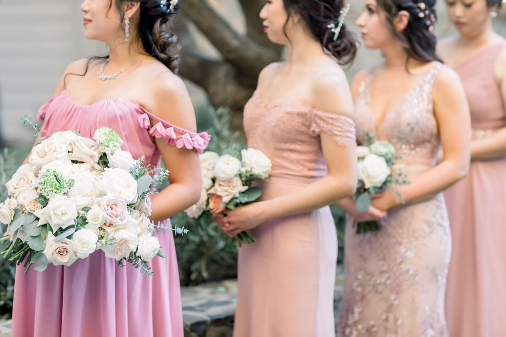 bridesmaids in mix matched pink dresses