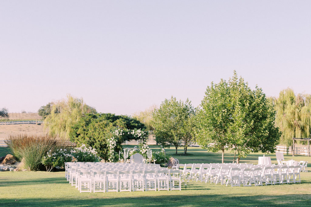 Persian wedding ceremony at Saddlerock ranch with white chiavari chairs