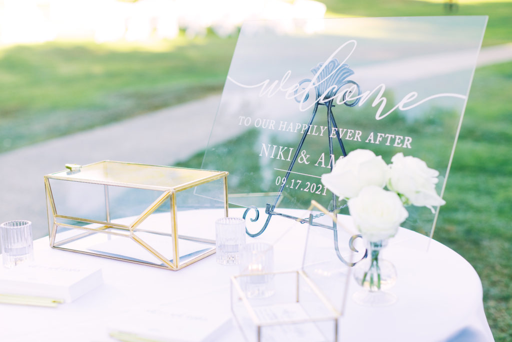 acrylic wedding welcome sign with gold card box at white-tie wedding