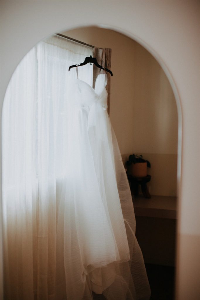 modern bridal wedding gown with asymmetrical tulle layers