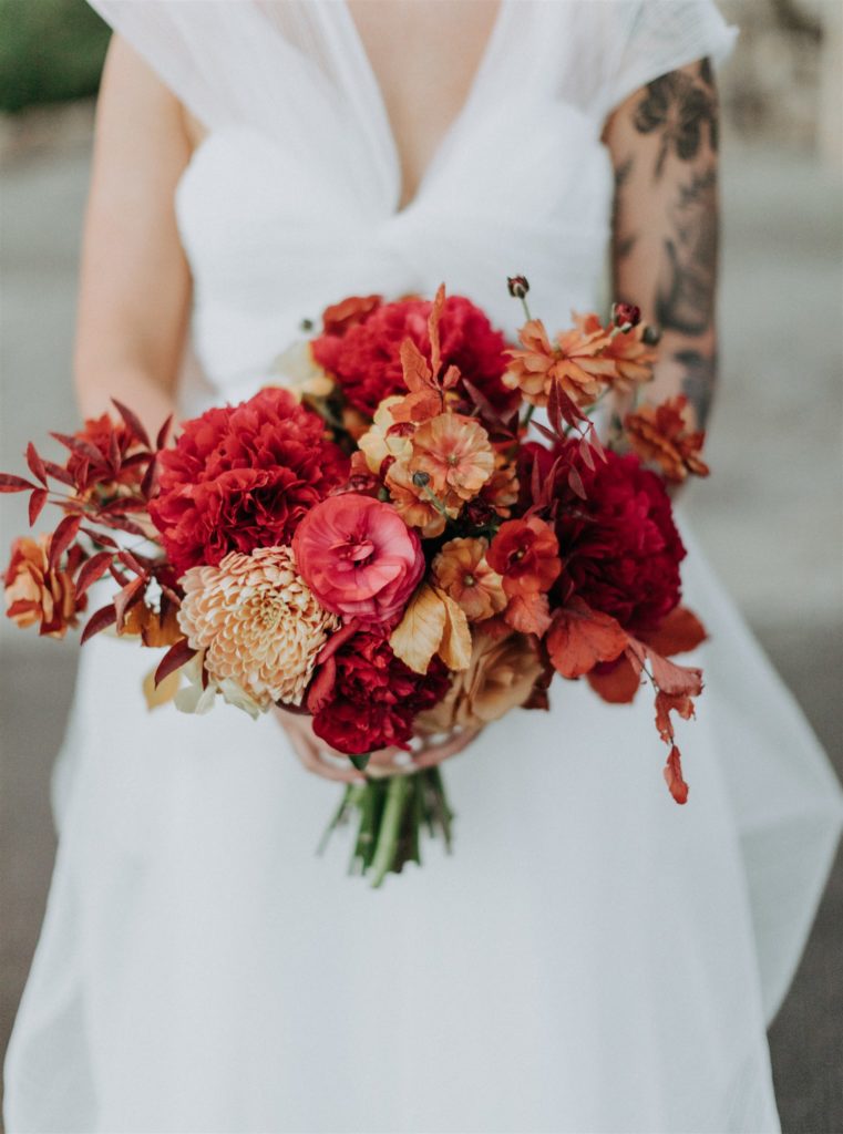 bright bridal bouquet with deep red, orange and yellow flowers