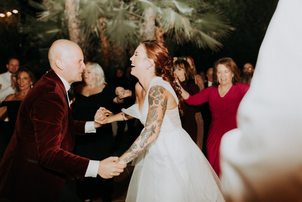 bride and groom dance together during wedding reception