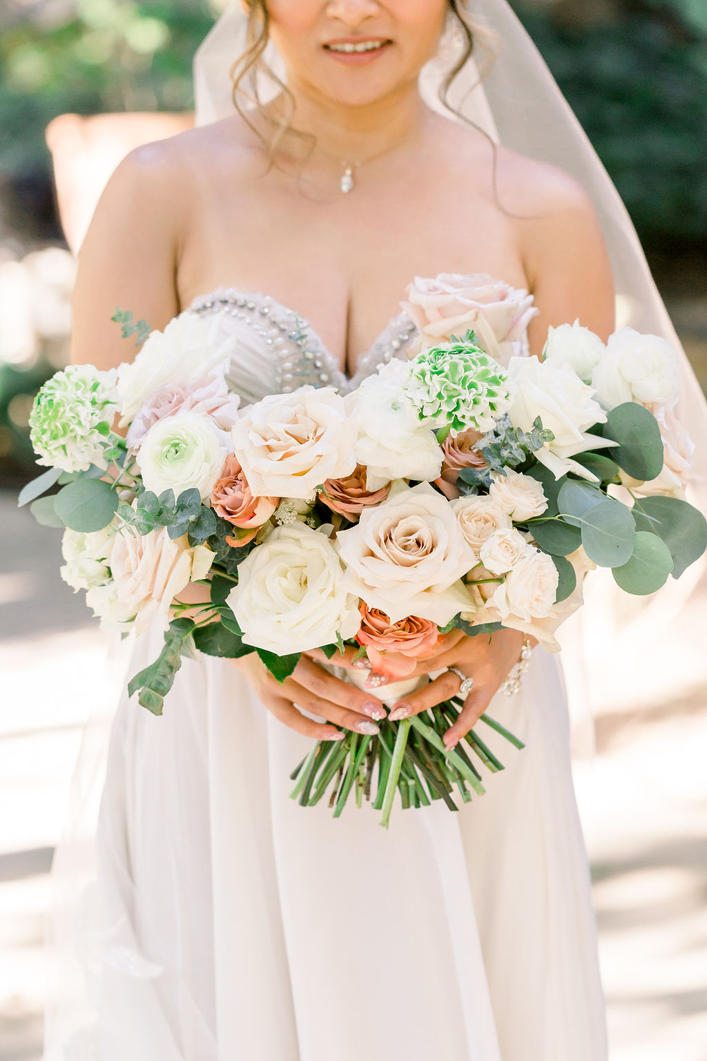 romantic and glamorous wedding bouquet with pink and white roses and eucalyptus