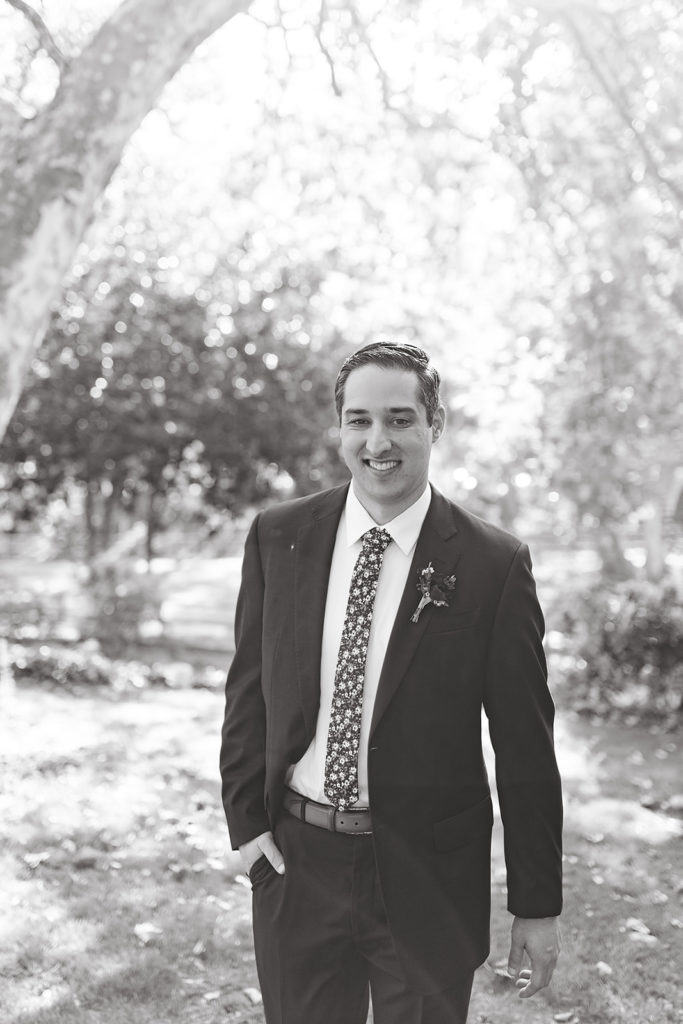 Outdoor wedding portrait shots at Temecula Creek Inn with groom in navy suit and floral tie