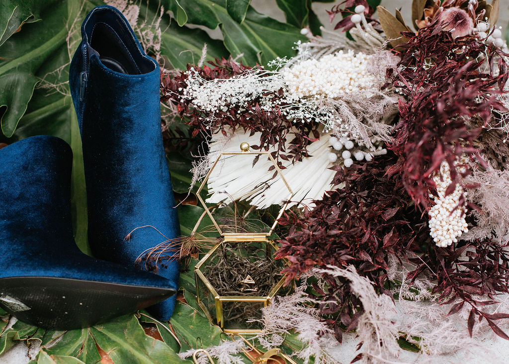bridal blue booties with dried floral bouquet and ring in gold ring box