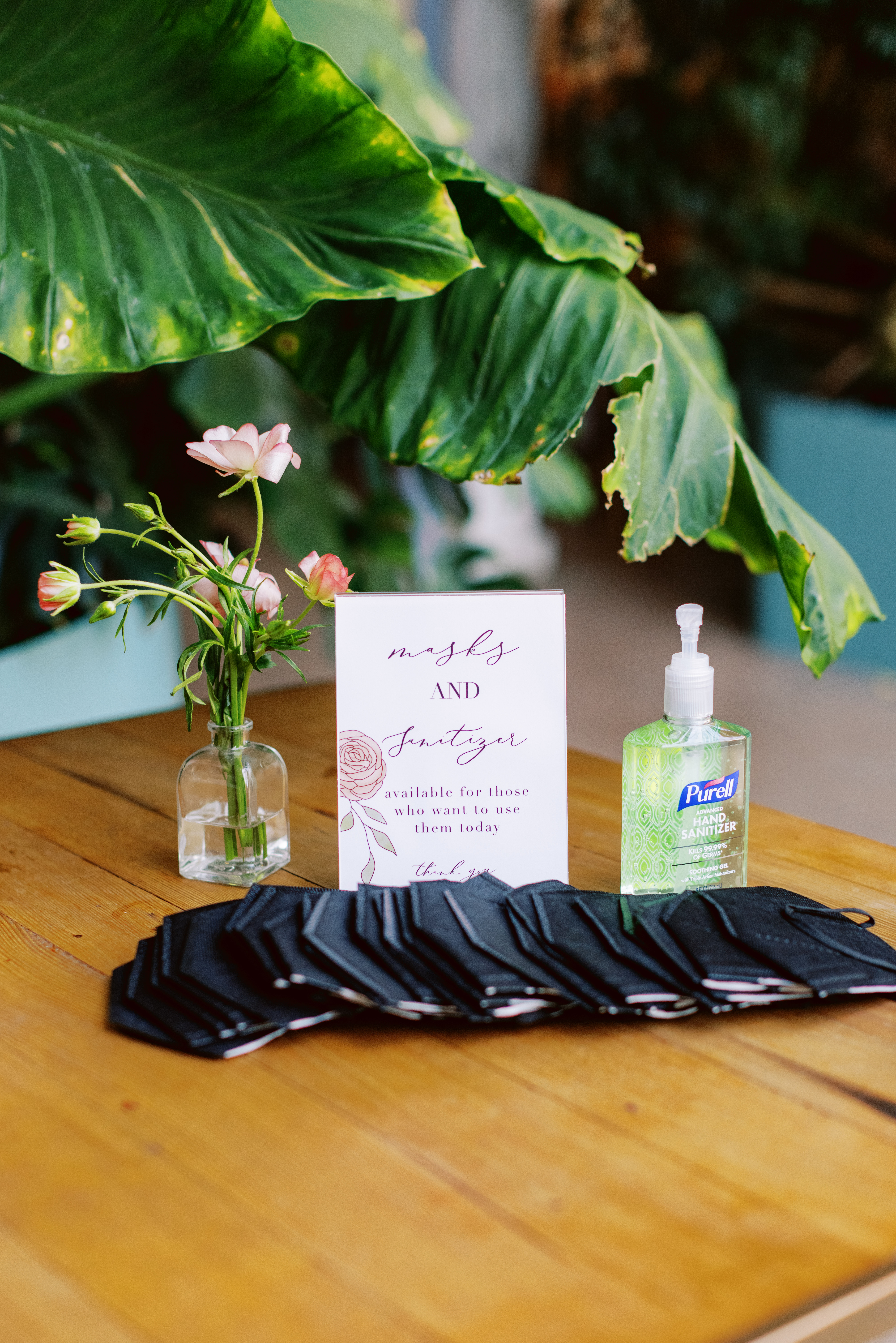 mask and sanitizer station during wedding cocktail hour
