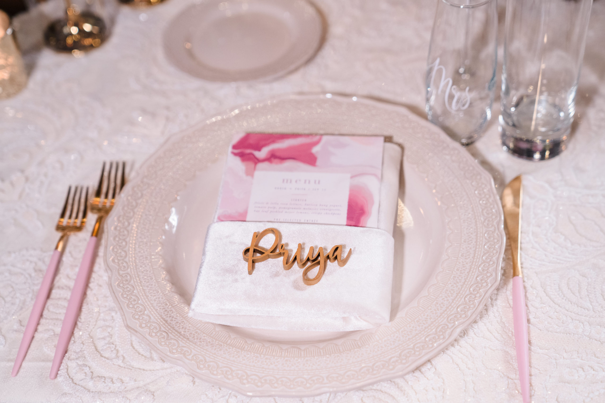 pink wedding reception menu tucked into napkin with 3d calligraphy name on napkin