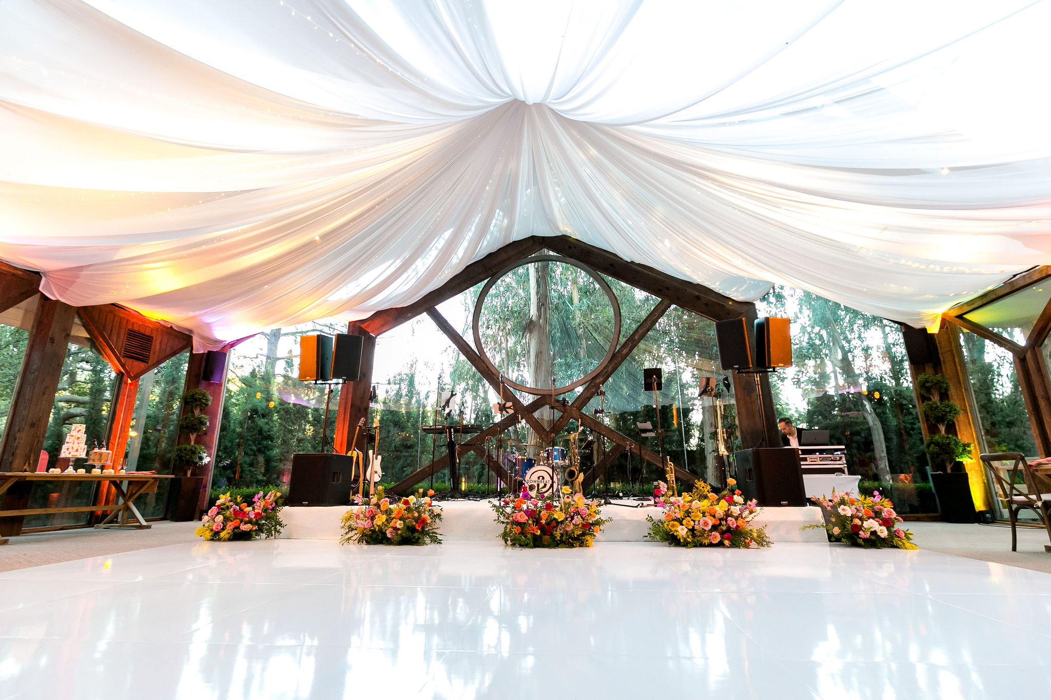 white gloss dance floor with tent in the Oak Room at Calamigos Ranch