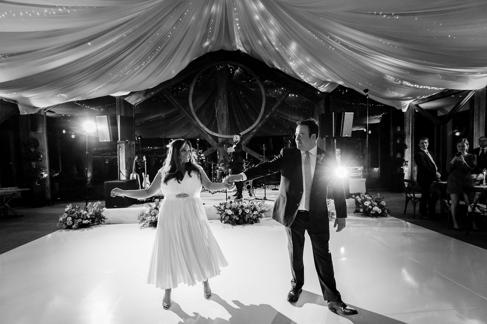 black and white photo of bride and groom dancing at Calamigos Ranch