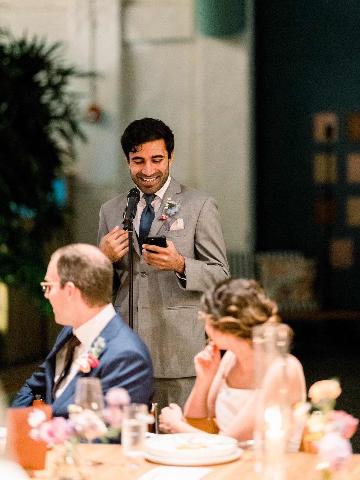 wedding guest gives speech during reception 