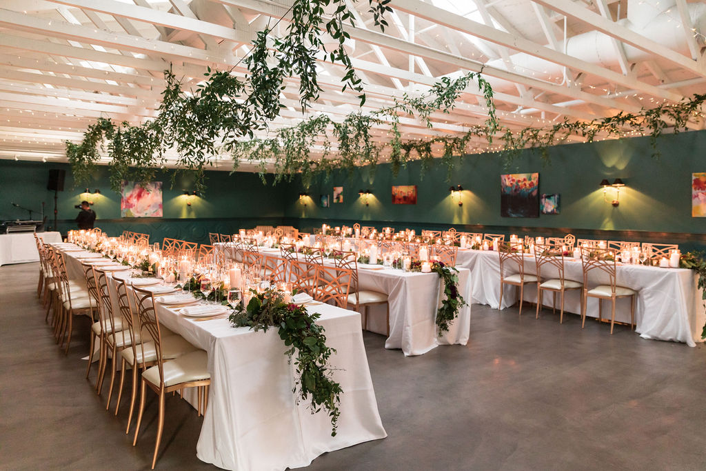indoor reception space at The Fig House with hanging greenery 