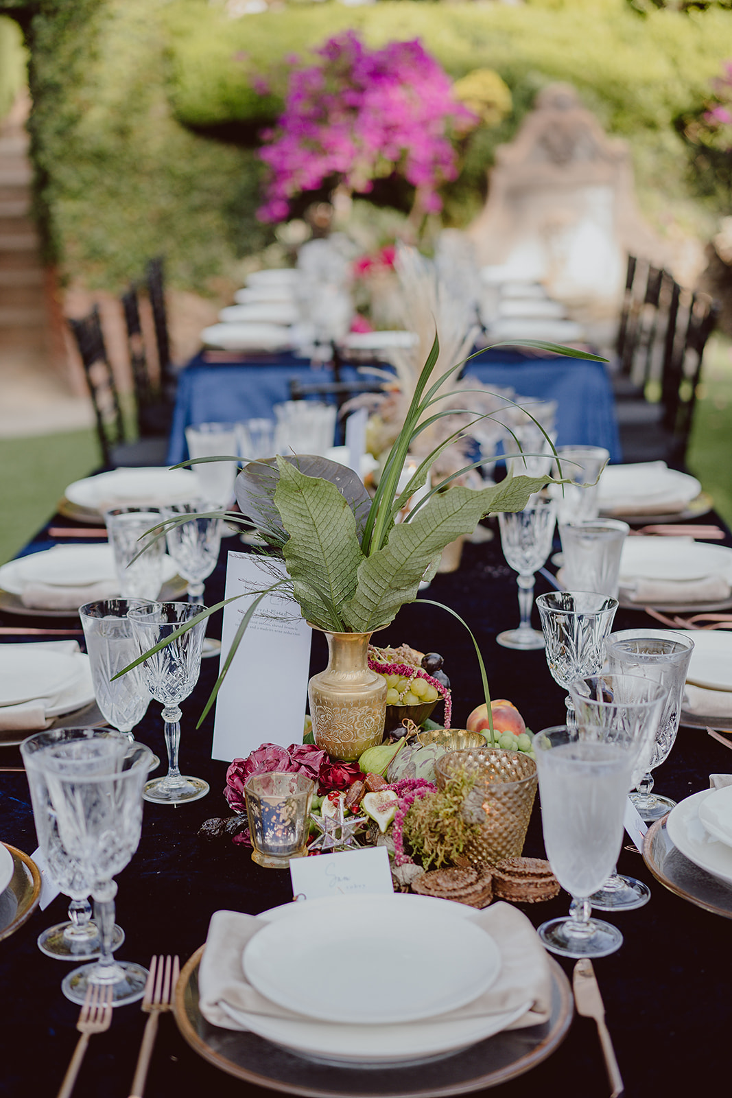 fruit centerpiece on black velvet linen and crystal glasses at wedding reception at Houdini Estate