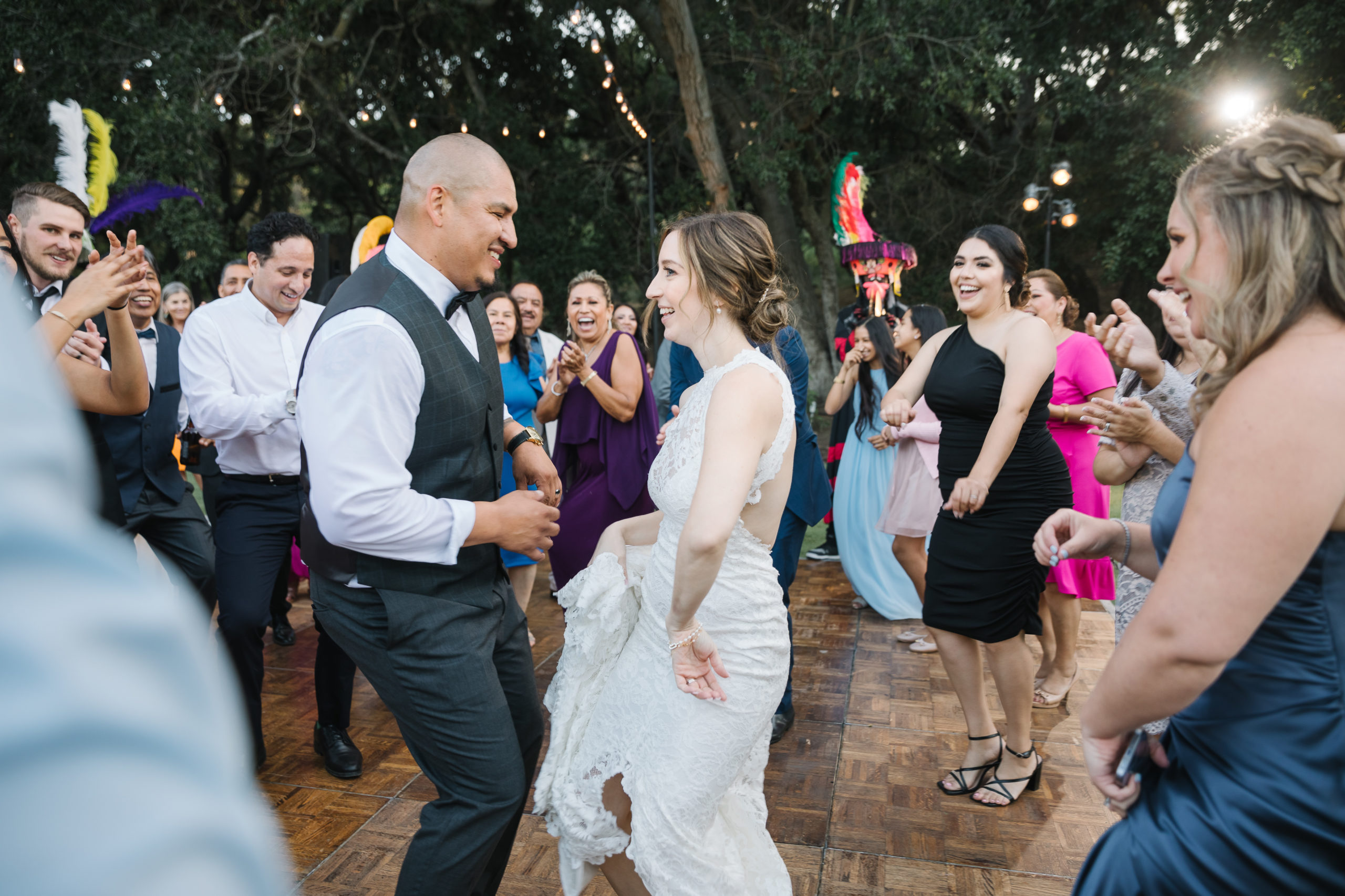 bride and groom dance during festive wedding reception at Saddlerock Ranch
