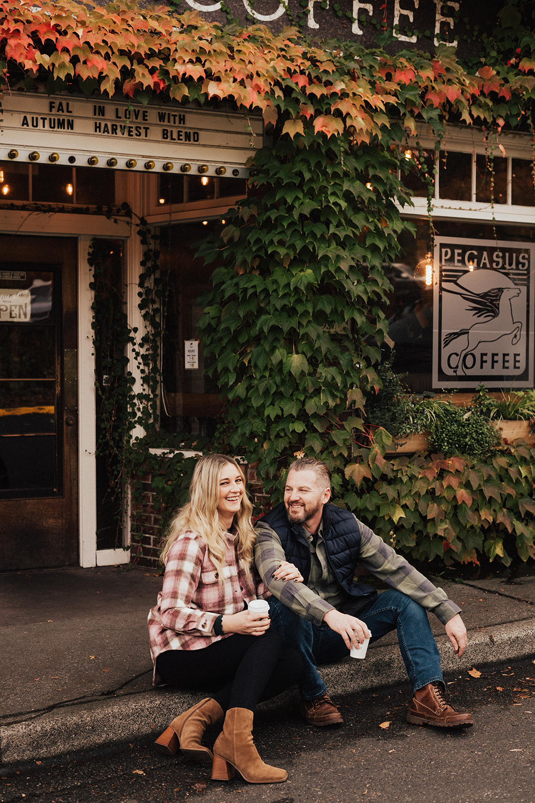 couple in Seattle coffee shop during fall engagement photo session
