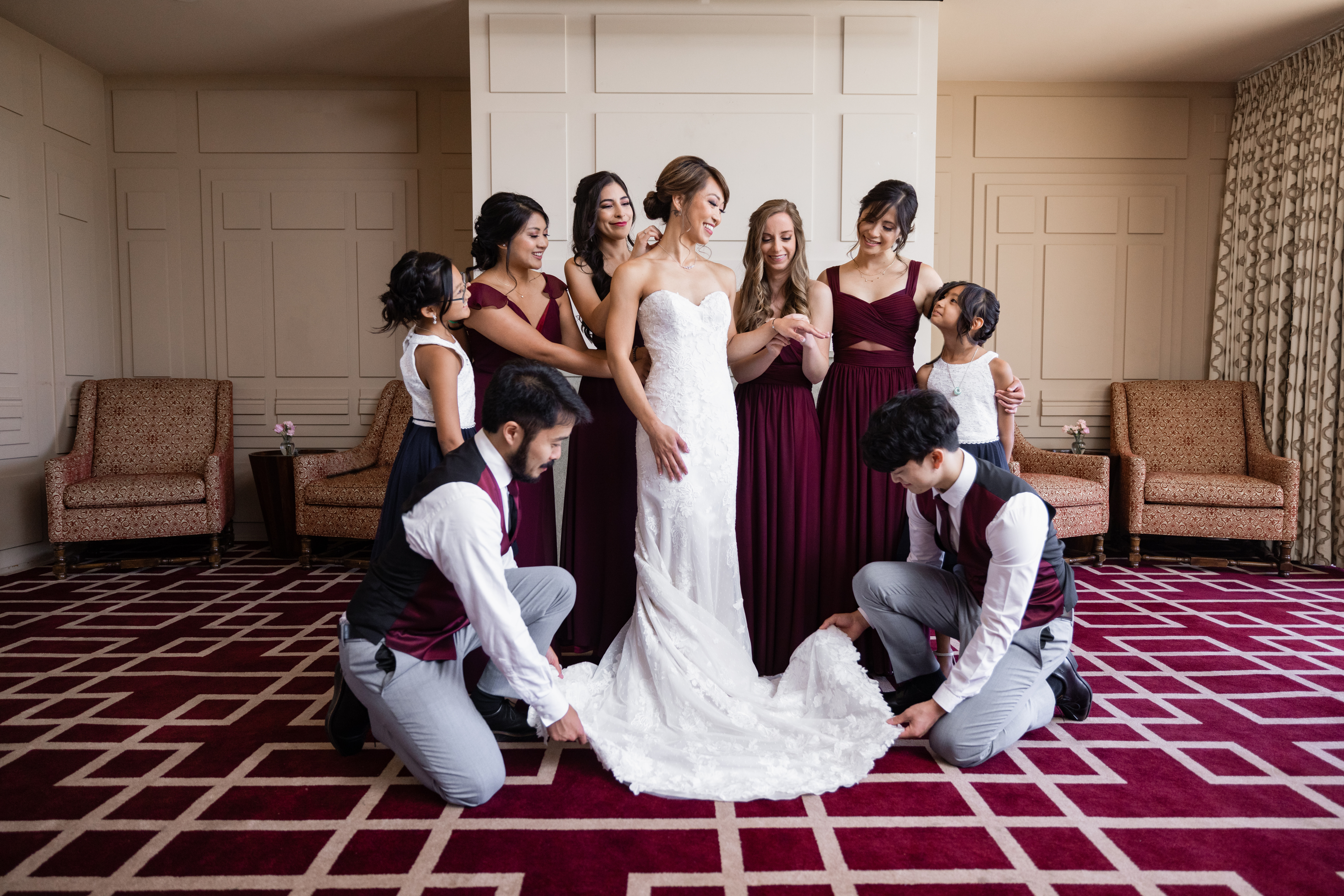 bride with co-ed wedding party in jewel toned maroon outfits