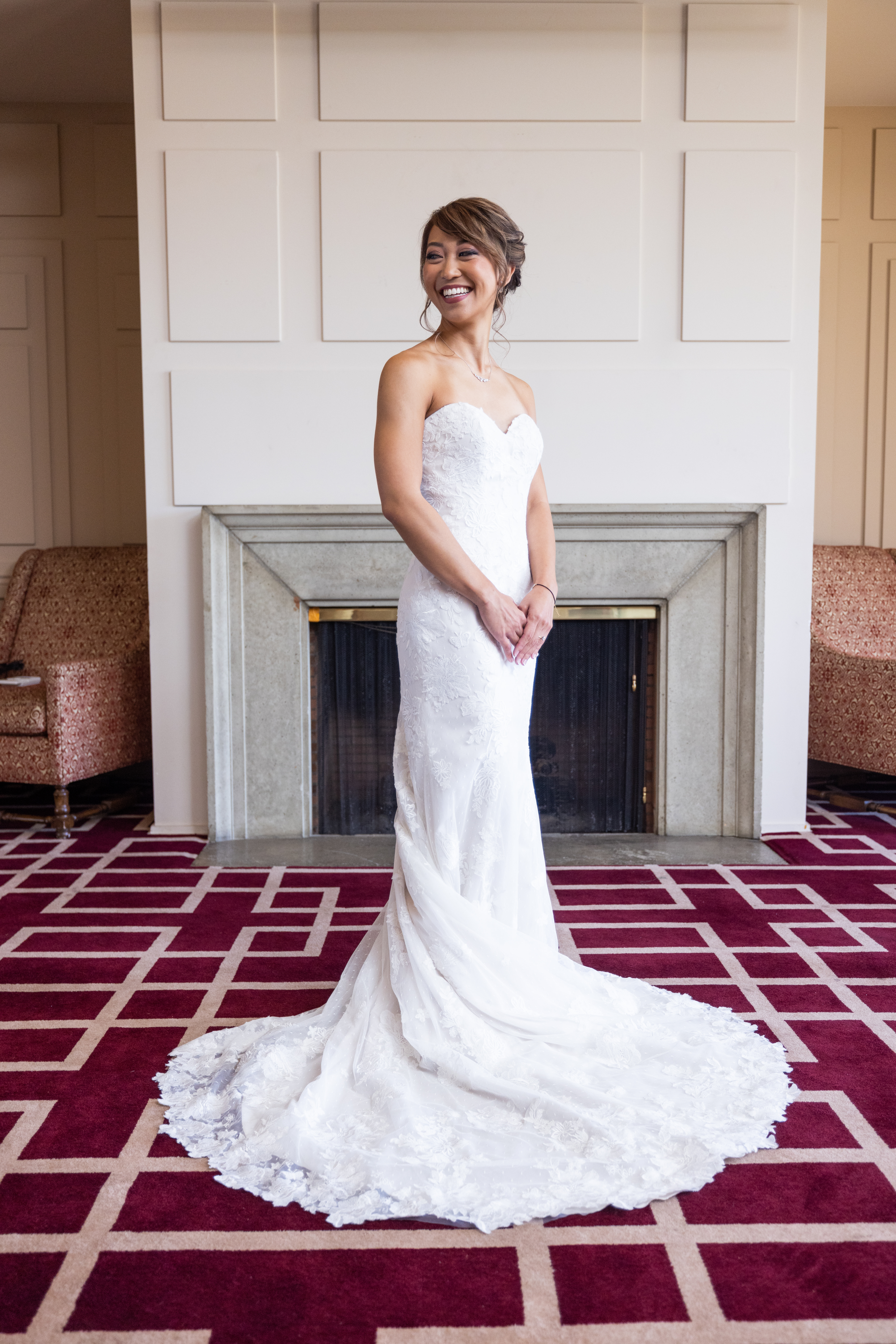 bride in strapless lace wedding dress wearing low chignon bun 