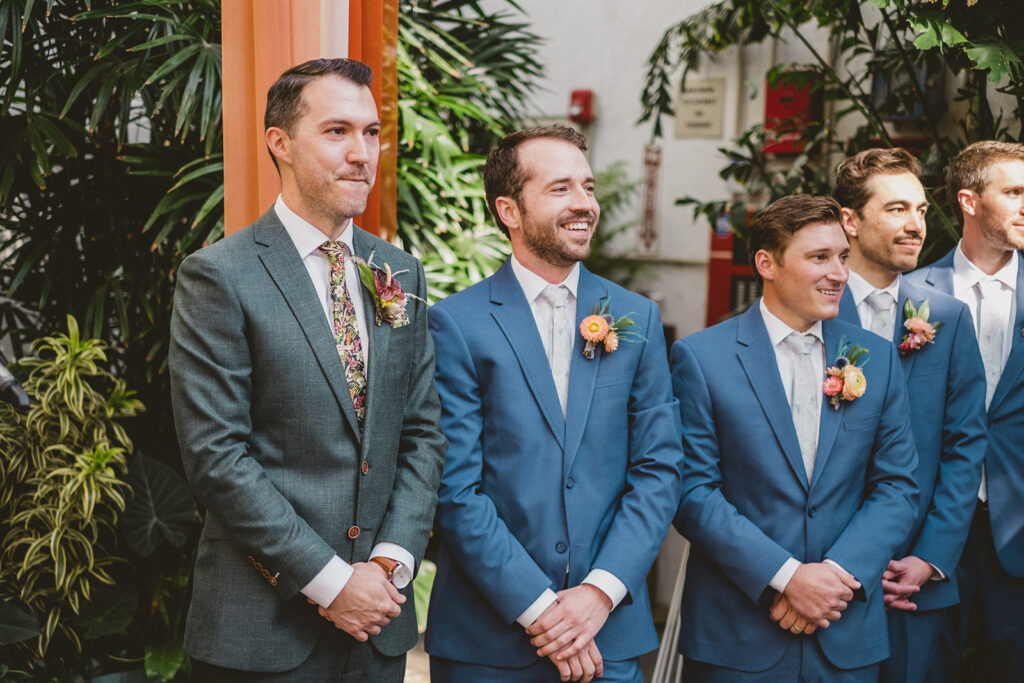 groom stands with groomsmen during wedding ceremony at Valentine DTLA