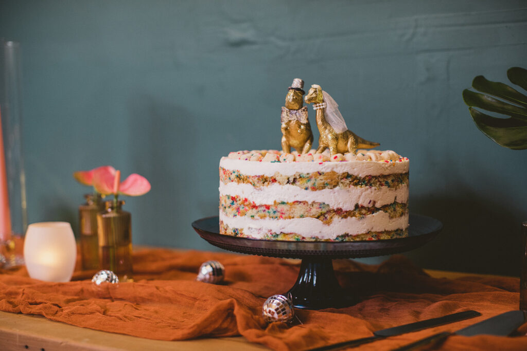 gold wedding dinosaur cake topper