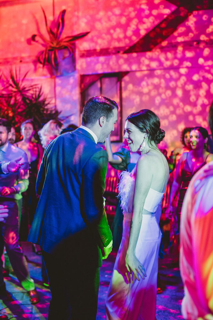 bride and groom dancing during jungle disco themed wedding reception at Valentine DTLA