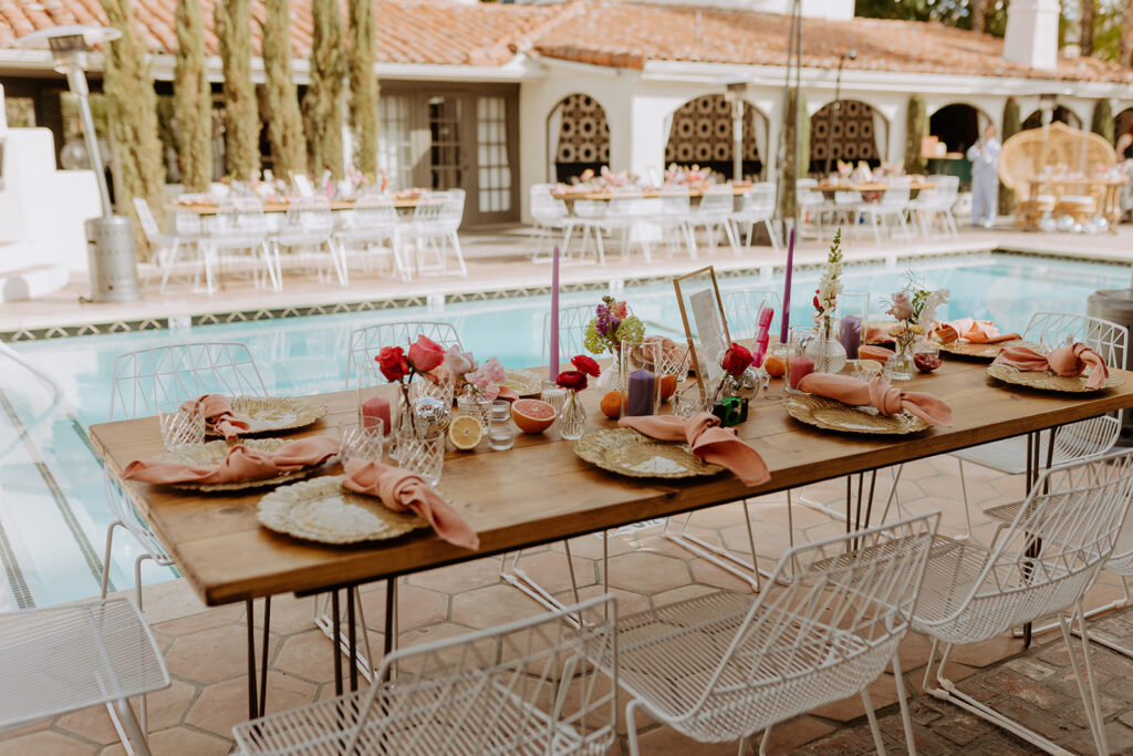 Colorful and eclectic pool side wedding reception with disco ball decor at Villa Royale Palm Springs