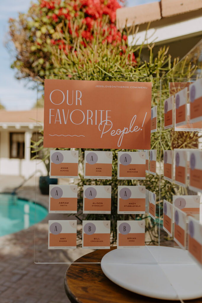 colorful mid-century inspired seating chart for pool side wedding reception at Villa Royale Palm Springs