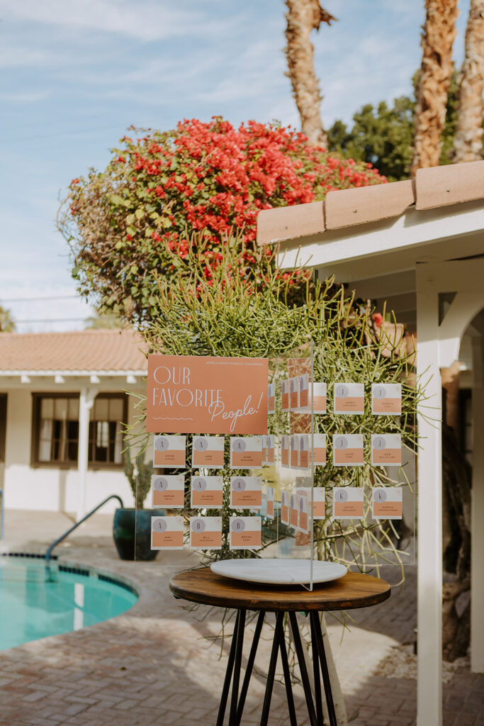 colorful mid-century inspired seating chart for pool side wedding reception at Villa Royale Palm Springs