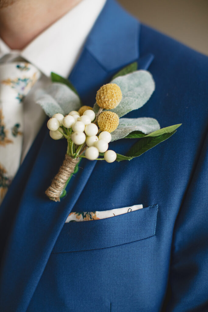 groom boutonniere with billy ball boutonniere 