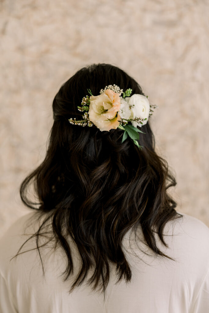 bridal hair do with flower clip 