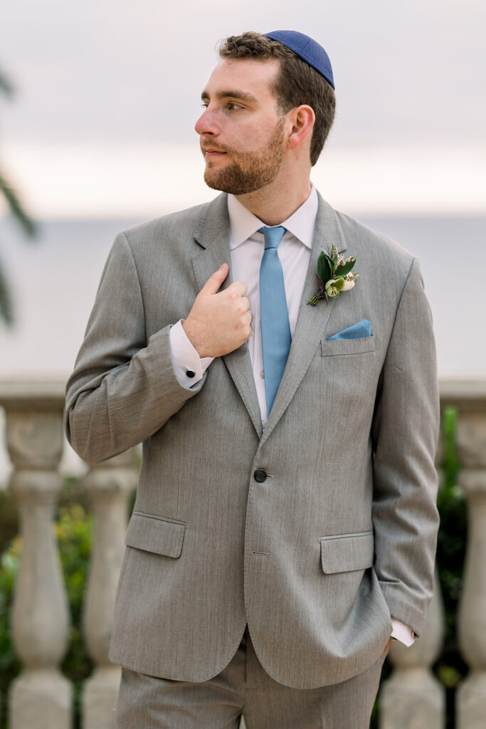 jewish groom in light grey suit and blue tie at Bel Air Bay Club