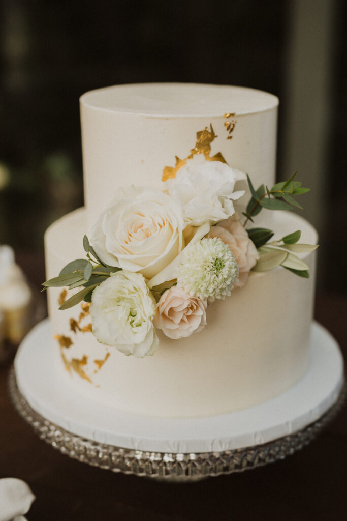 two tier wedding cake with gold foil
