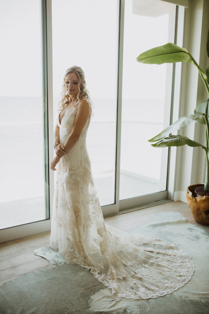bride in lace wedding dress with train