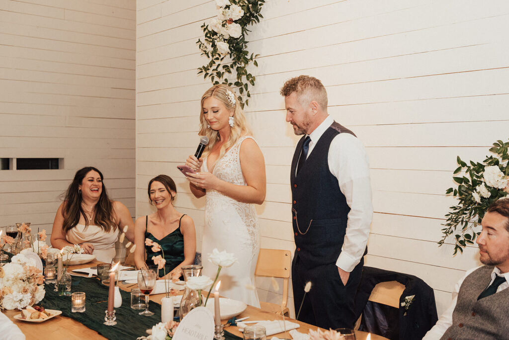 bride and groom give speech during reception