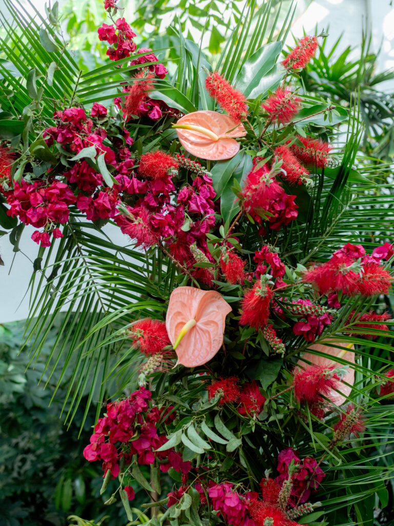 tropical inspired aisle floral ceremony arch