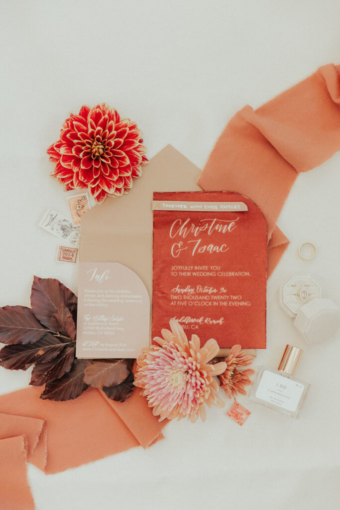 citrus inspired wedding invitation suite with orange tones