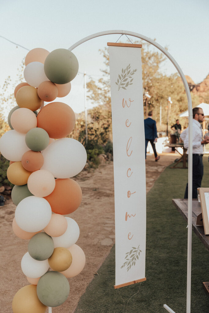 wedding welcome sign with baloon arch