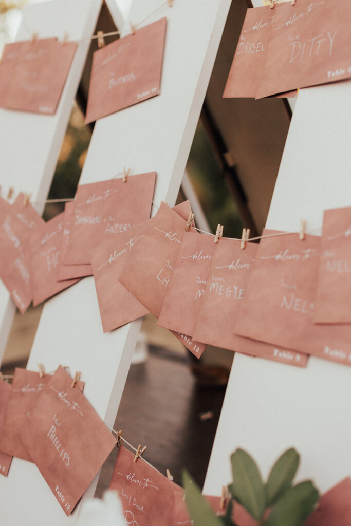 escort card display with red envelopes and note for reach guest