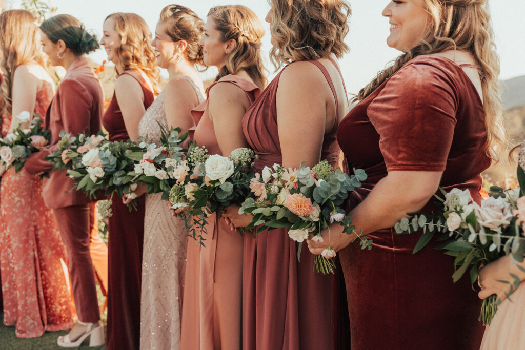 bridesmaids in mixed red dresses 