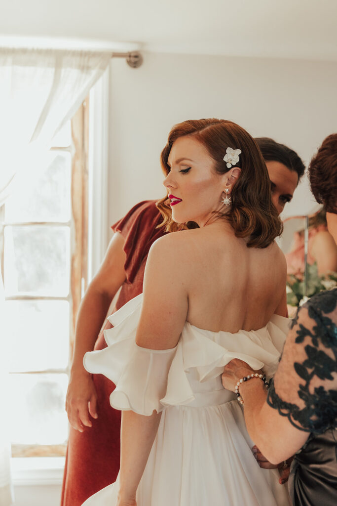 classic hollywood bridal look with soft waves and red lip 
