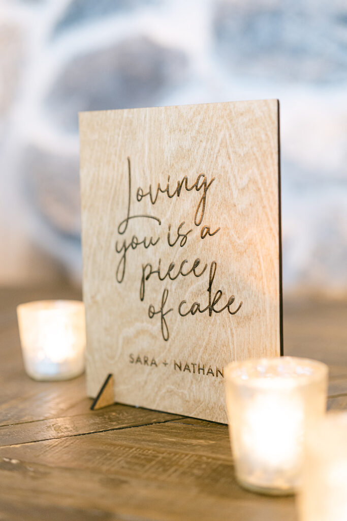 wooden dessert sign that reads loving you is a piece of cake