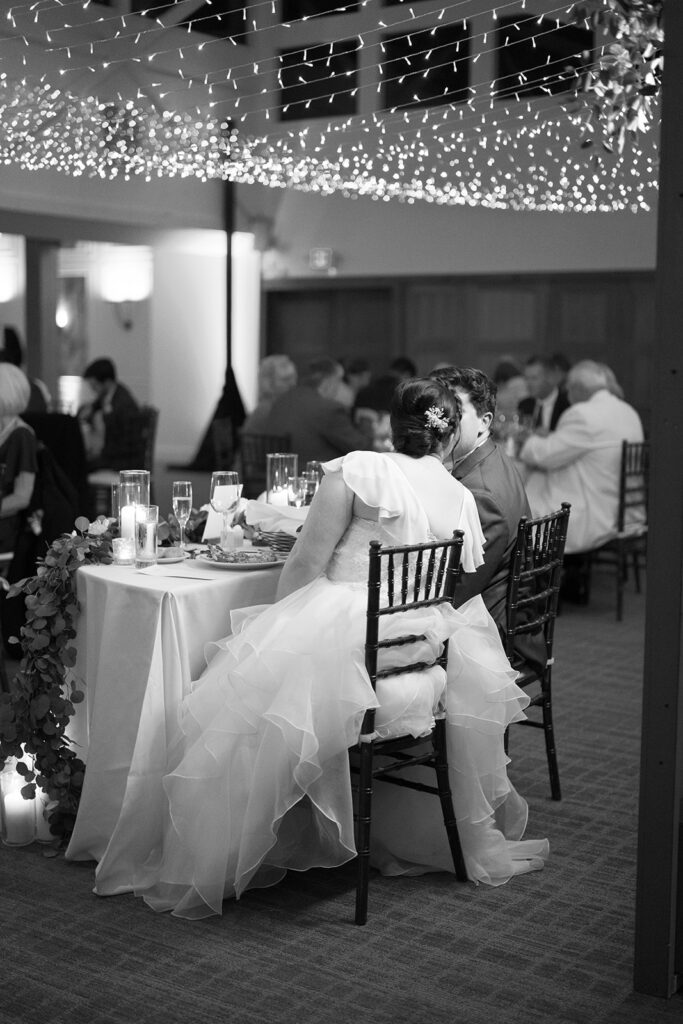 black and white photo of bride and groom kissing during wedding reception at Calamigos Ranch