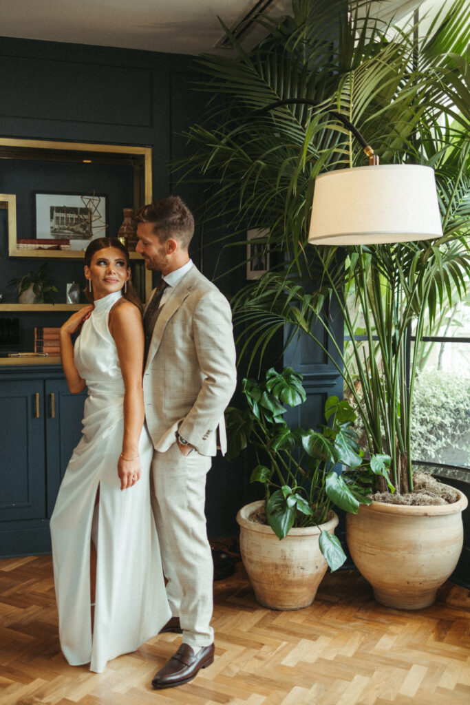 bride in satin halter wedding dress and groom in khaki plaid suit portrait shots at Calamigos Ranch